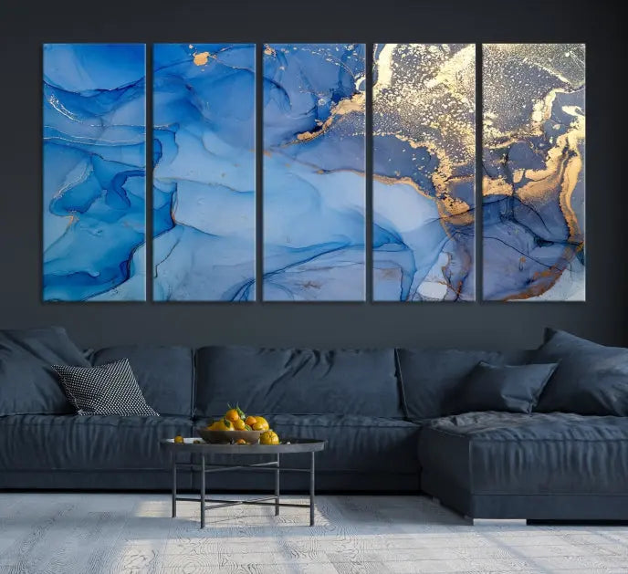 Modern living room featuring the Blue Gold Marble Fluid Canvas Wall Art that showcases three-panel abstract designs in blue and gold on museum-quality canvas. These art pieces are professionally hand-assembled for an exquisite finish.