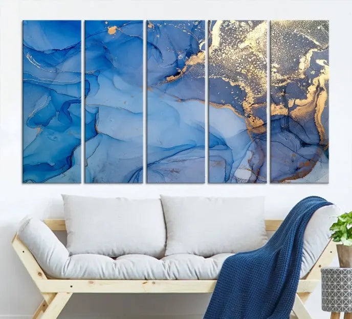 Modern living room featuring the Blue Gold Marble Fluid Canvas Wall Art that showcases three-panel abstract designs in blue and gold on museum-quality canvas. These art pieces are professionally hand-assembled for an exquisite finish.