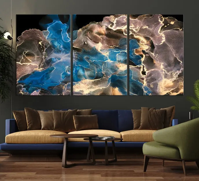 The Blue Golden Marble Wall Art Abstract Canvas Print, ready to hang, enhances the elegance of the modern living room.