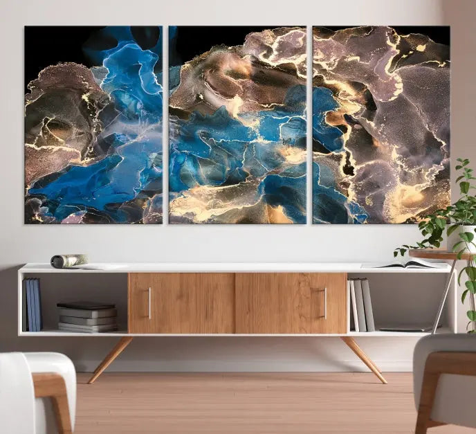 The Blue Golden Marble Wall Art Abstract Canvas Print, ready to hang, enhances the elegance of the modern living room.