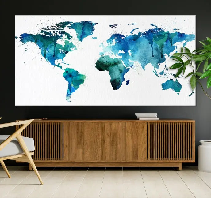 The Blue Green Dominated World Map Canvas Wall Art features a triptych design in watercolor shades of blue and green. It's printed on museum-quality canvas with a UV-protective coating and is ready to hang, bringing an artistic flair to any space.