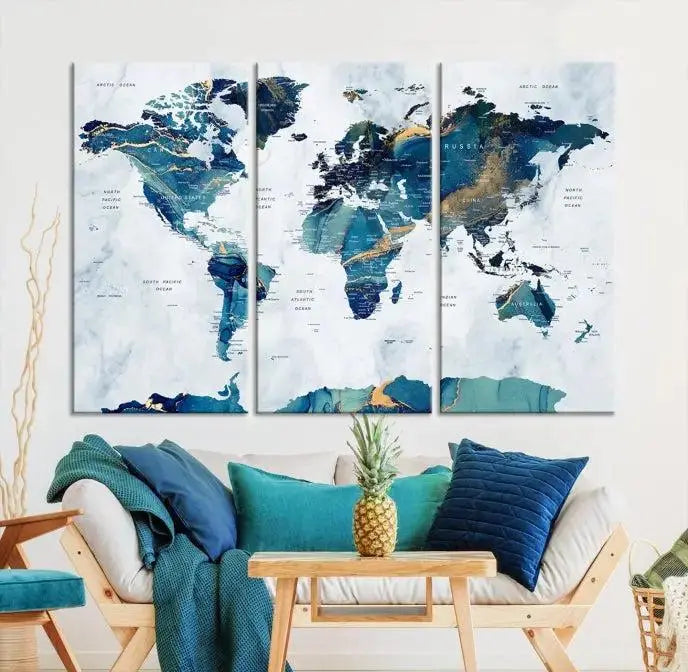 The modern living room showcases the Blue Green World Map Wall Art Canvas Print, a captivating three-panel artwork crafted on museum-quality canvases with a UV-protective coating.