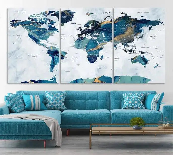 The modern living room showcases the Blue Green World Map Wall Art Canvas Print, a captivating three-panel artwork crafted on museum-quality canvases with a UV-protective coating.