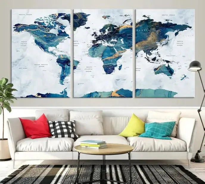 The modern living room showcases the Blue Green World Map Wall Art Canvas Print, a captivating three-panel artwork crafted on museum-quality canvases with a UV-protective coating.