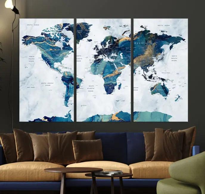 The modern living room showcases the Blue Green World Map Wall Art Canvas Print, a captivating three-panel artwork crafted on museum-quality canvases with a UV-protective coating.