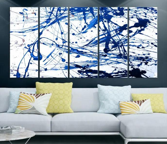 The Blue Ink Splash Wall Art Canvas Print Success is a triptych abstract piece featuring blue splatters on a clean white background. Crafted on gallery-wrapped canvases of museum quality, it includes a UV-protective coating to maintain its vibrant allure for years.