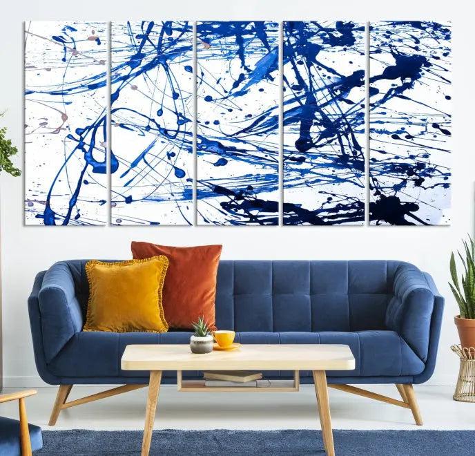 The Blue Ink Splash Wall Art Canvas Print Success is a triptych abstract piece featuring blue splatters on a clean white background. Crafted on gallery-wrapped canvases of museum quality, it includes a UV-protective coating to maintain its vibrant allure for years.