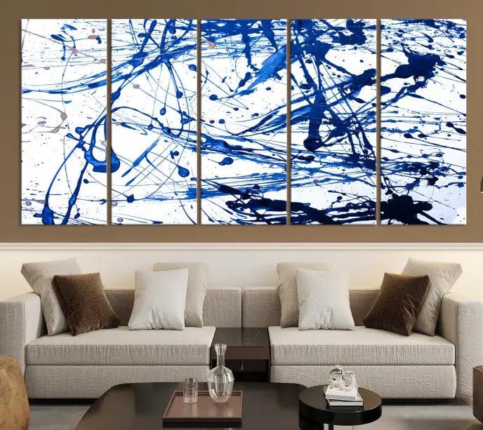 The Blue Ink Splash Wall Art Canvas Print Success is a triptych abstract piece featuring blue splatters on a clean white background. Crafted on gallery-wrapped canvases of museum quality, it includes a UV-protective coating to maintain its vibrant allure for years.