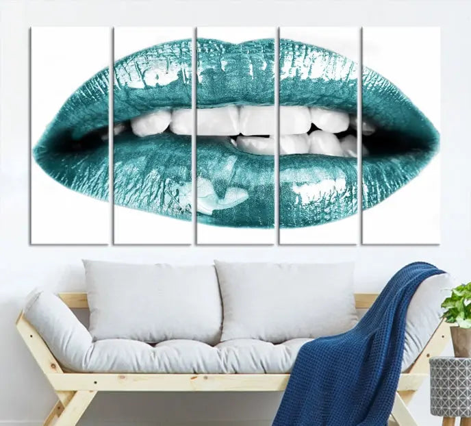 The "Blue Lips Wall Art Canvas Print," a contemporary three-panel piece, serves as a striking centerpiece in the room.