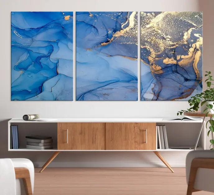 The "Blue Marble Effect Wall Art Abstract Canvas Wall Art Print" showcases an exquisite blend of blue and gold hues. This hand-assembled piece is crafted on museum-quality canvas and includes a UV-protective coating to preserve its vibrant colors over time.