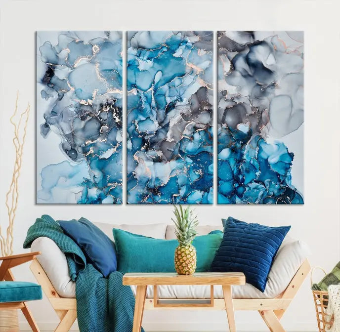 The "Blue Marble Fluid Effect Wall Art Abstract Canvas Wall Art Print" is a triptych that showcases captivating blue and gray abstract patterns on museum-quality canvas. It is enhanced with a UV-protective coating to maintain its vivid colors over time.