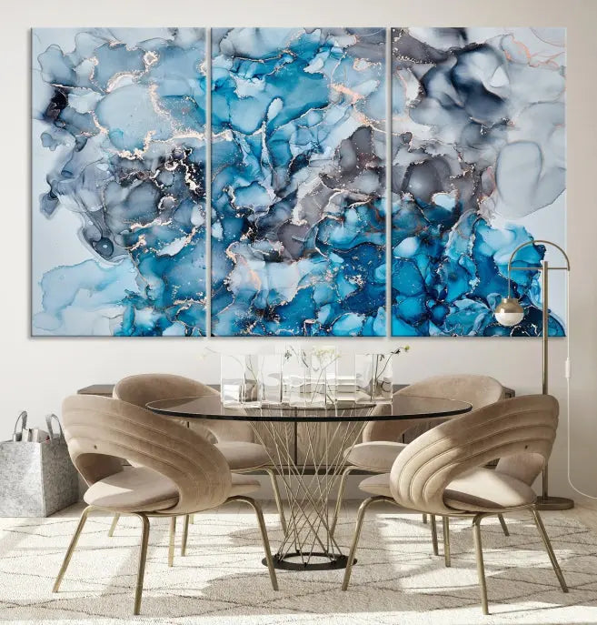 The "Blue Marble Fluid Effect Wall Art Abstract Canvas Wall Art Print" is a triptych that showcases captivating blue and gray abstract patterns on museum-quality canvas. It is enhanced with a UV-protective coating to maintain its vivid colors over time.