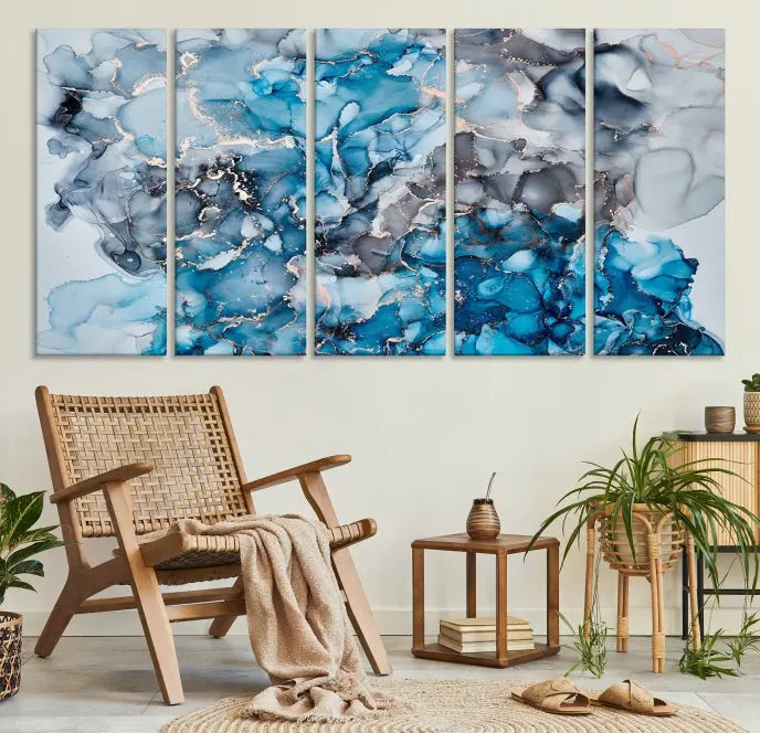 The "Blue Marble Fluid Effect Wall Art Abstract Canvas Wall Art Print" is a triptych that showcases captivating blue and gray abstract patterns on museum-quality canvas. It is enhanced with a UV-protective coating to maintain its vivid colors over time.