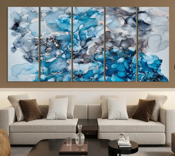 The "Blue Marble Fluid Effect Wall Art Abstract Canvas Wall Art Print" is a triptych that showcases captivating blue and gray abstract patterns on museum-quality canvas. It is enhanced with a UV-protective coating to maintain its vivid colors over time.