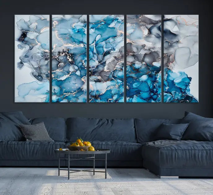 The "Blue Marble Fluid Effect Wall Art Abstract Canvas Wall Art Print" is a triptych that showcases captivating blue and gray abstract patterns on museum-quality canvas. It is enhanced with a UV-protective coating to maintain its vivid colors over time.