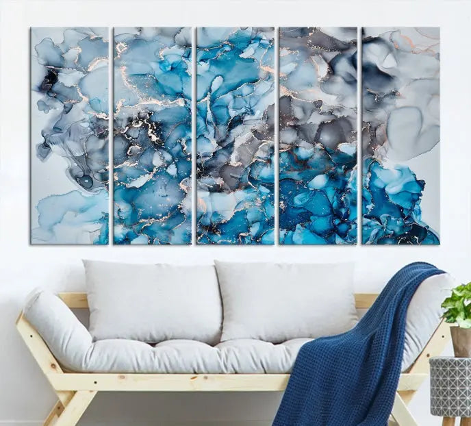 The "Blue Marble Fluid Effect Wall Art Abstract Canvas Wall Art Print" is a triptych that showcases captivating blue and gray abstract patterns on museum-quality canvas. It is enhanced with a UV-protective coating to maintain its vivid colors over time.