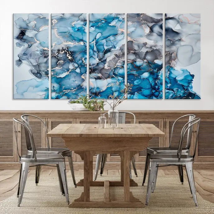 The "Blue Marble Fluid Effect Wall Art Abstract Canvas Wall Art Print" is a triptych that showcases captivating blue and gray abstract patterns on museum-quality canvas. It is enhanced with a UV-protective coating to maintain its vivid colors over time.