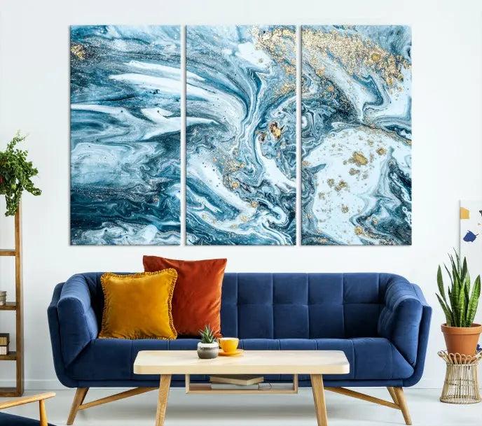 A triptych piece titled "Blue Marble Fluid Effect Wall Art Canvas Wall Art Print," featuring an abstract design in blue and gold on museum-quality canvas with a UV-protective coating, graces the wall.