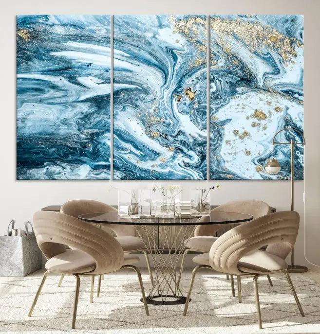 A triptych piece titled "Blue Marble Fluid Effect Wall Art Canvas Wall Art Print," featuring an abstract design in blue and gold on museum-quality canvas with a UV-protective coating, graces the wall.