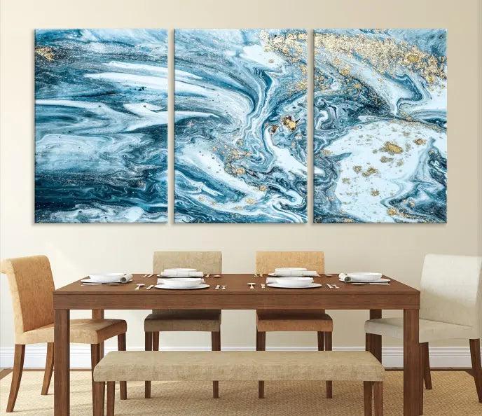 A triptych piece titled "Blue Marble Fluid Effect Wall Art Canvas Wall Art Print," featuring an abstract design in blue and gold on museum-quality canvas with a UV-protective coating, graces the wall.