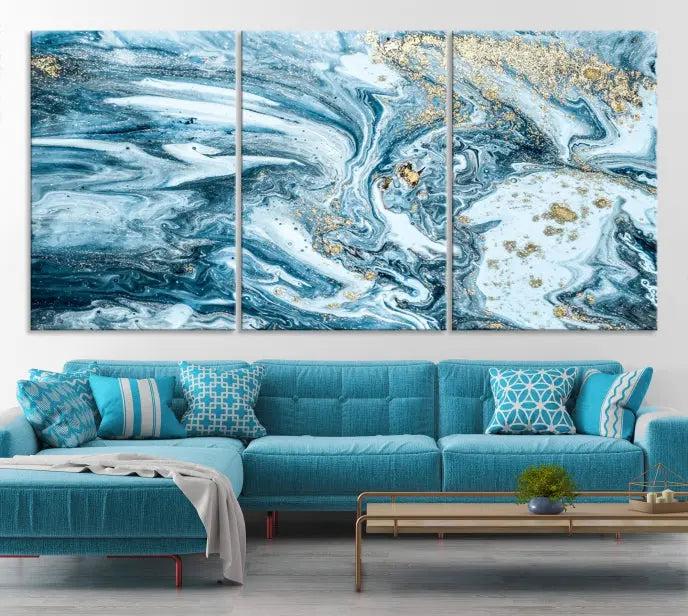 A triptych piece titled "Blue Marble Fluid Effect Wall Art Canvas Wall Art Print," featuring an abstract design in blue and gold on museum-quality canvas with a UV-protective coating, graces the wall.