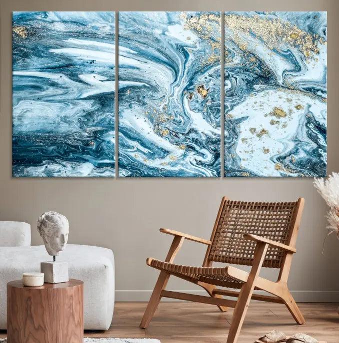 A triptych piece titled "Blue Marble Fluid Effect Wall Art Canvas Wall Art Print," featuring an abstract design in blue and gold on museum-quality canvas with a UV-protective coating, graces the wall.