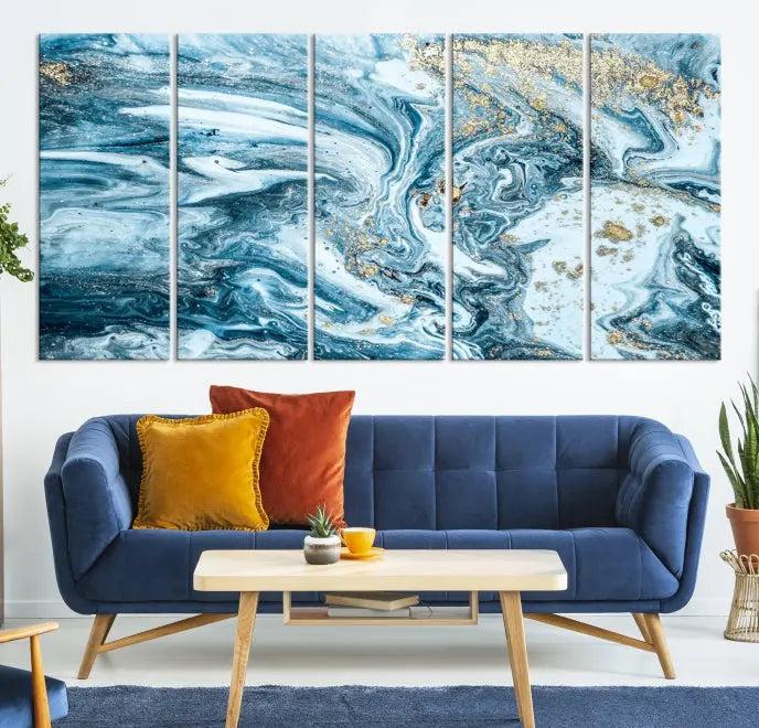 A triptych piece titled "Blue Marble Fluid Effect Wall Art Canvas Wall Art Print," featuring an abstract design in blue and gold on museum-quality canvas with a UV-protective coating, graces the wall.