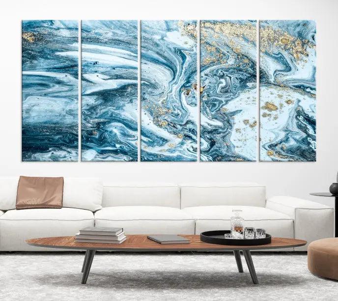 A triptych piece titled "Blue Marble Fluid Effect Wall Art Canvas Wall Art Print," featuring an abstract design in blue and gold on museum-quality canvas with a UV-protective coating, graces the wall.