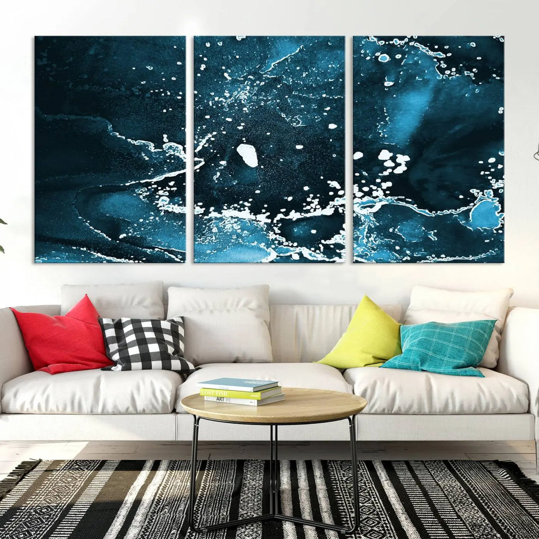 The Blue Marble Ink Splash Effect Wall Art Abstract Canvas Wall Art Print features a gallery-wrapped finish on museum-quality canvas with UV-protective coating, hanging elegantly in the room.