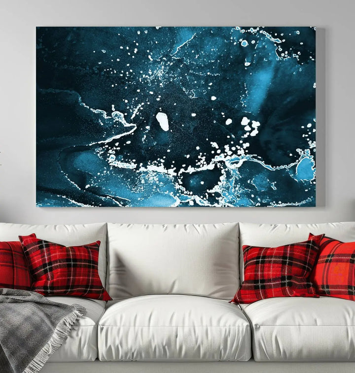 The Blue Marble Ink Splash Effect Wall Art Abstract Canvas Wall Art Print features a gallery-wrapped finish on museum-quality canvas with UV-protective coating, hanging elegantly in the room.