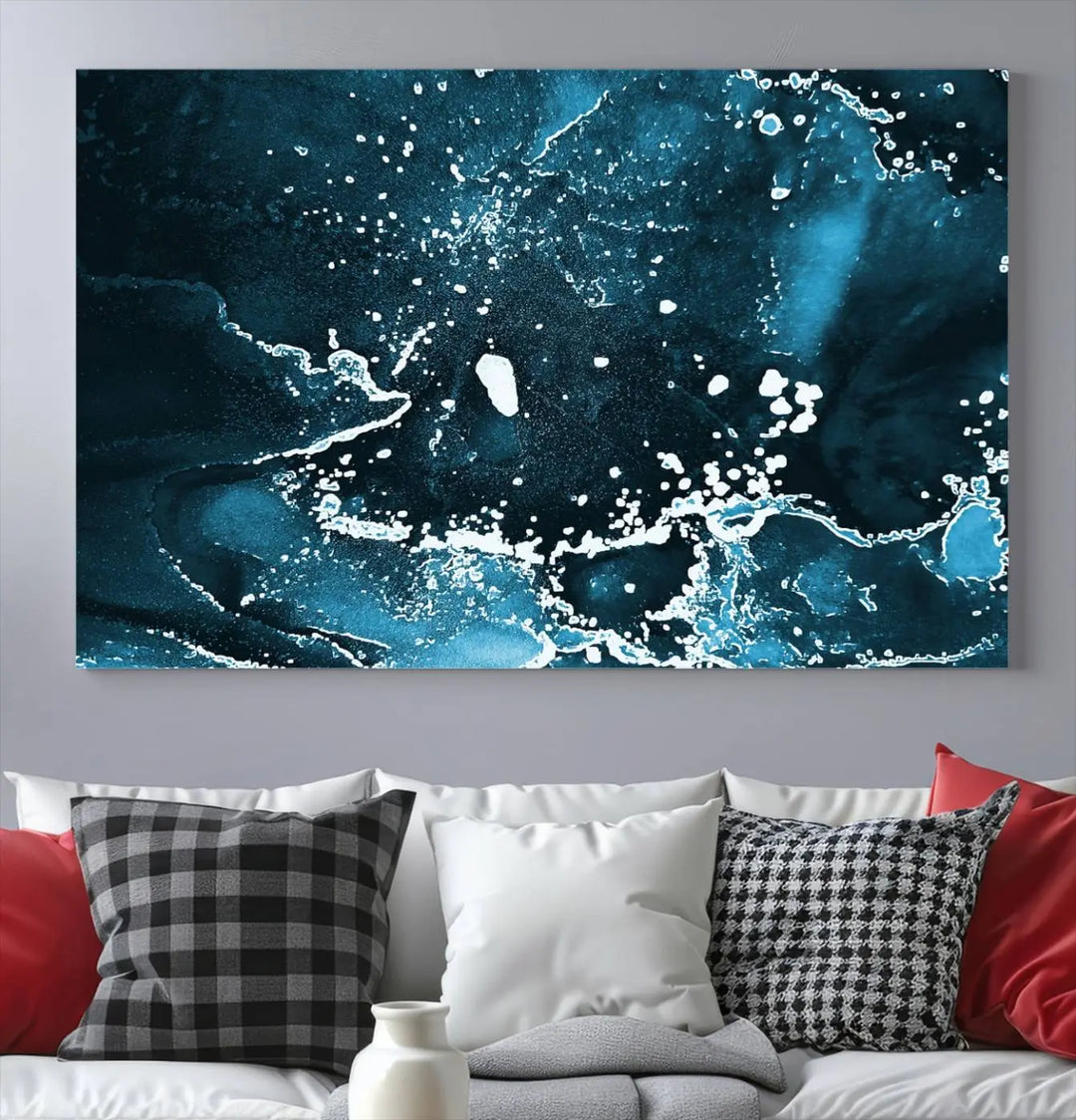 The Blue Marble Ink Splash Effect Wall Art Abstract Canvas Wall Art Print features a gallery-wrapped finish on museum-quality canvas with UV-protective coating, hanging elegantly in the room.