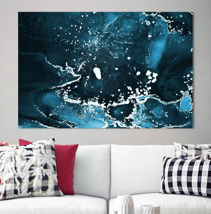 The Blue Marble Ink Splash Effect Wall Art Abstract Canvas Wall Art Print features a gallery-wrapped finish on museum-quality canvas with UV-protective coating, hanging elegantly in the room.