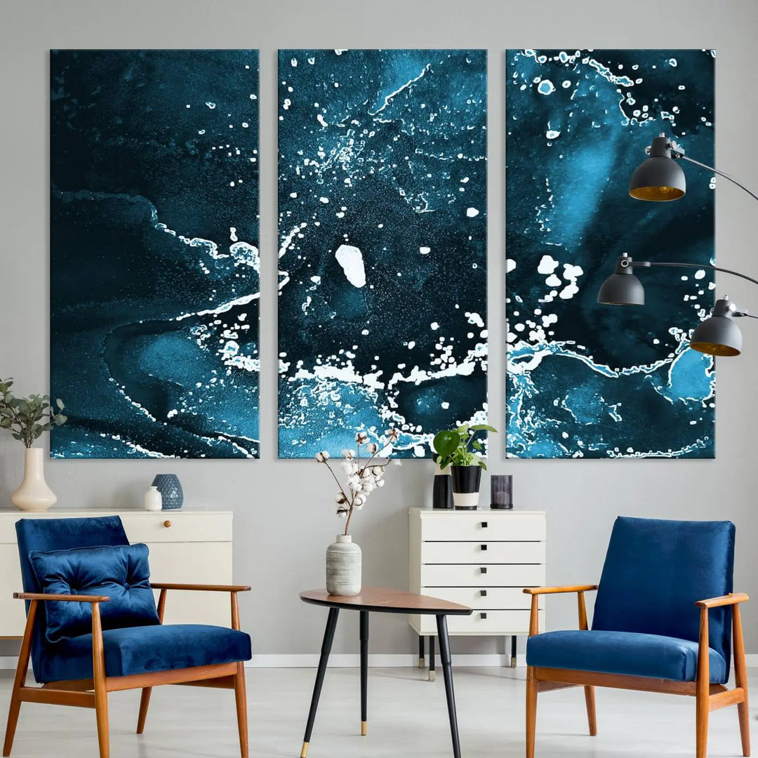 The Blue Marble Ink Splash Effect Wall Art Abstract Canvas Wall Art Print features a gallery-wrapped finish on museum-quality canvas with UV-protective coating, hanging elegantly in the room.