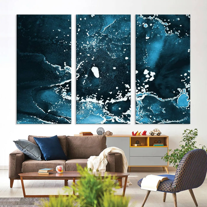 The Blue Marble Ink Splash Effect Wall Art Abstract Canvas Wall Art Print features a gallery-wrapped finish on museum-quality canvas with UV-protective coating, hanging elegantly in the room.