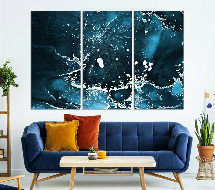 The Blue Marble Ink Splash Effect Wall Art Abstract Canvas Wall Art Print features a gallery-wrapped finish on museum-quality canvas with UV-protective coating, hanging elegantly in the room.