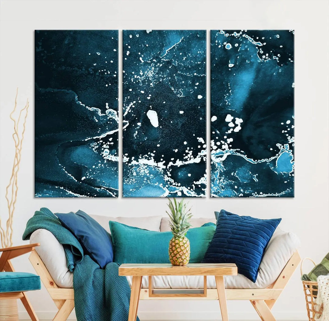 The Blue Marble Ink Splash Effect Wall Art Abstract Canvas Wall Art Print features a gallery-wrapped finish on museum-quality canvas with UV-protective coating, hanging elegantly in the room.