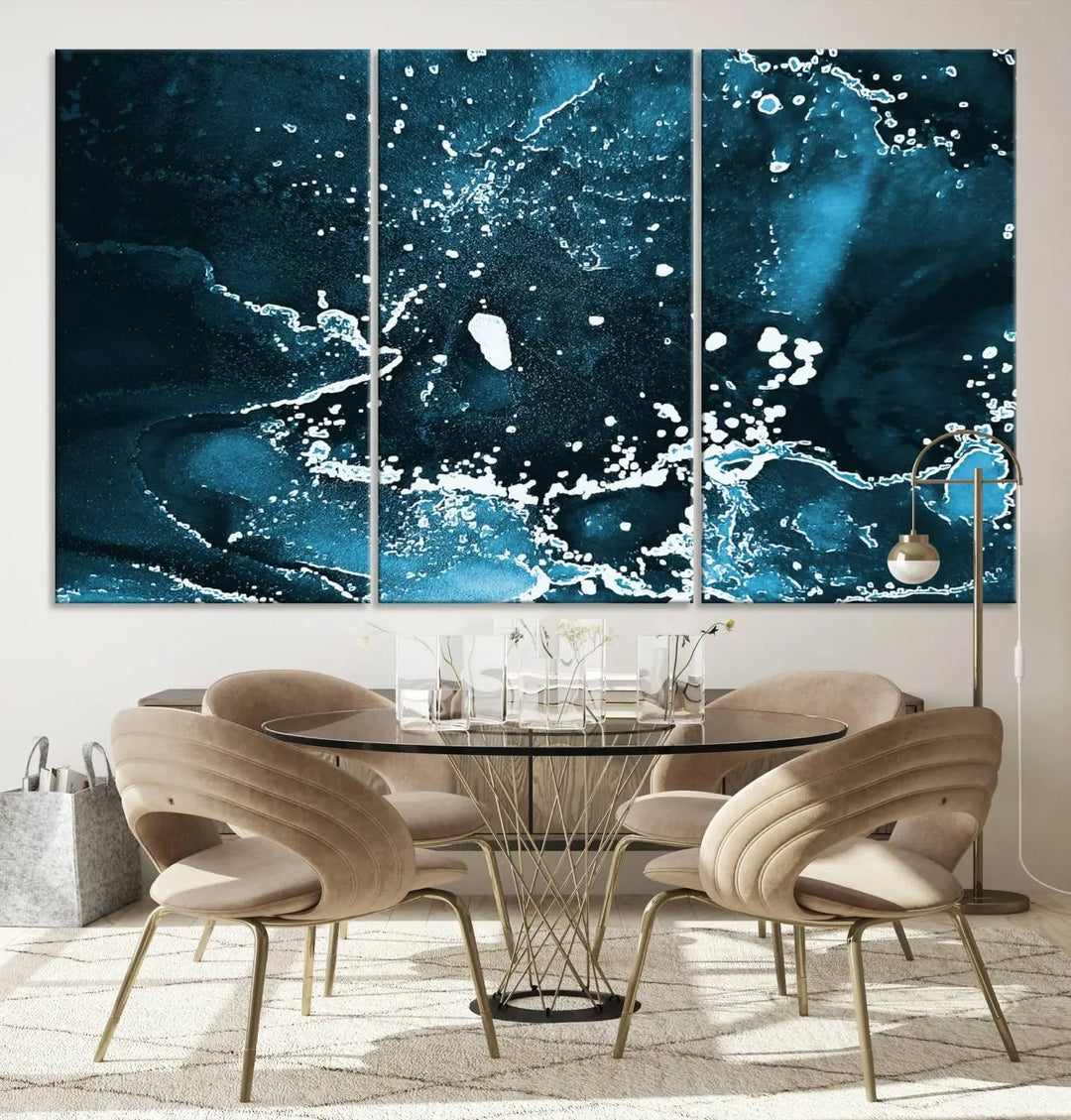 The Blue Marble Ink Splash Effect Wall Art Abstract Canvas Wall Art Print features a gallery-wrapped finish on museum-quality canvas with UV-protective coating, hanging elegantly in the room.