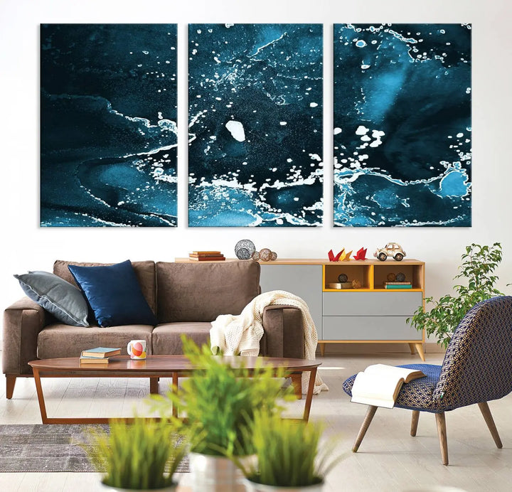 The Blue Marble Ink Splash Effect Wall Art Abstract Canvas Wall Art Print features a gallery-wrapped finish on museum-quality canvas with UV-protective coating, hanging elegantly in the room.