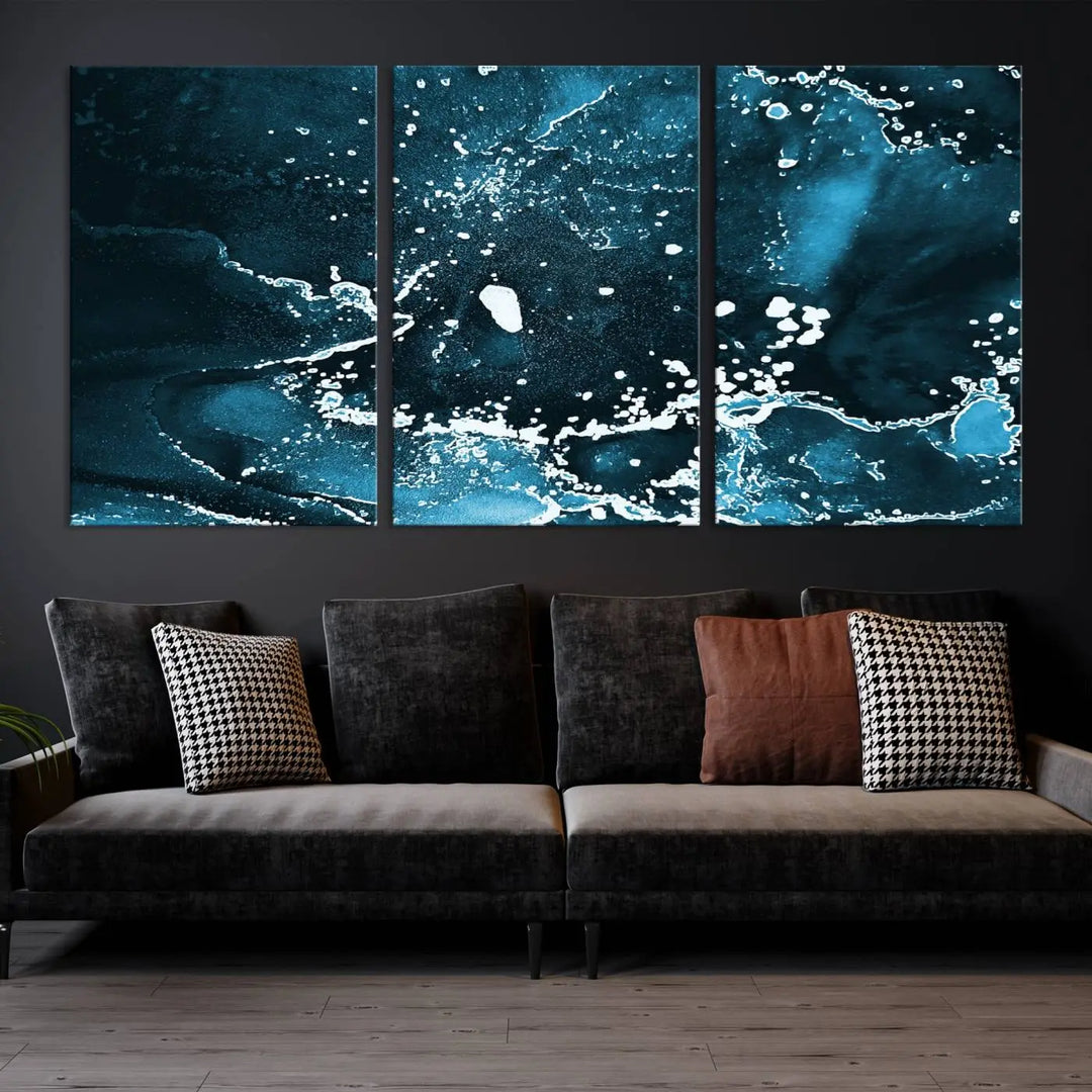 The Blue Marble Ink Splash Effect Wall Art Abstract Canvas Wall Art Print features a gallery-wrapped finish on museum-quality canvas with UV-protective coating, hanging elegantly in the room.