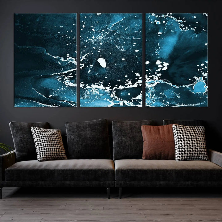 The Blue Marble Ink Splash Effect Wall Art Abstract Canvas Wall Art Print features a gallery-wrapped finish on museum-quality canvas with UV-protective coating, hanging elegantly in the room.