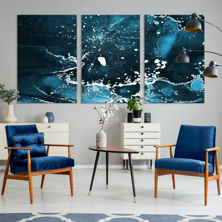 The Blue Marble Ink Splash Effect Wall Art Abstract Canvas Wall Art Print features a gallery-wrapped finish on museum-quality canvas with UV-protective coating, hanging elegantly in the room.