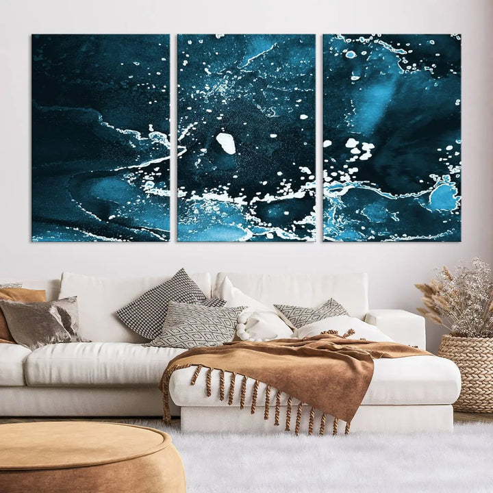 The Blue Marble Ink Splash Effect Wall Art Abstract Canvas Wall Art Print features a gallery-wrapped finish on museum-quality canvas with UV-protective coating, hanging elegantly in the room.