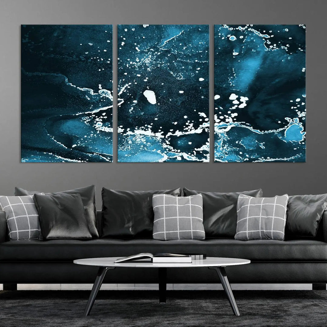 The Blue Marble Ink Splash Effect Wall Art Abstract Canvas Wall Art Print features a gallery-wrapped finish on museum-quality canvas with UV-protective coating, hanging elegantly in the room.