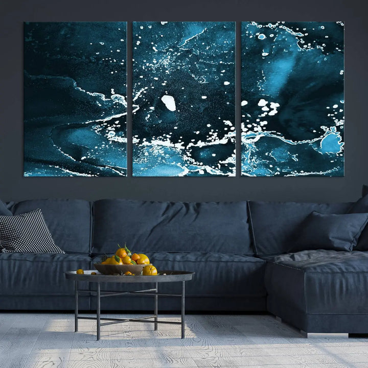 The Blue Marble Ink Splash Effect Wall Art Abstract Canvas Wall Art Print features a gallery-wrapped finish on museum-quality canvas with UV-protective coating, hanging elegantly in the room.