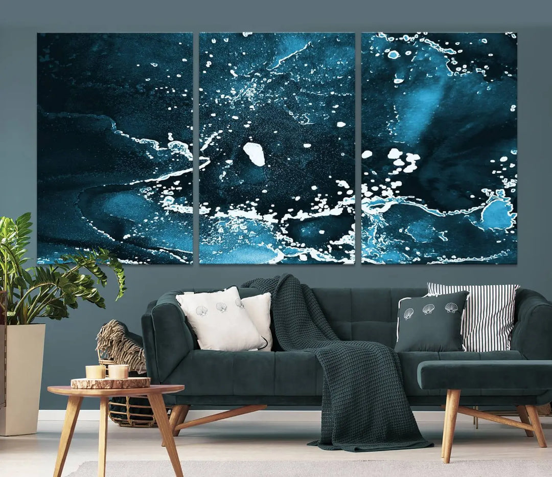 The Blue Marble Ink Splash Effect Wall Art Abstract Canvas Wall Art Print features a gallery-wrapped finish on museum-quality canvas with UV-protective coating, hanging elegantly in the room.