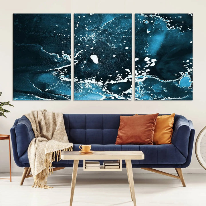 The Blue Marble Ink Splash Effect Wall Art Abstract Canvas Wall Art Print features a gallery-wrapped finish on museum-quality canvas with UV-protective coating, hanging elegantly in the room.