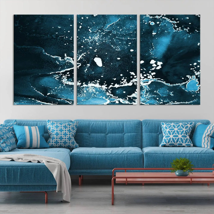 The Blue Marble Ink Splash Effect Wall Art Abstract Canvas Wall Art Print features a gallery-wrapped finish on museum-quality canvas with UV-protective coating, hanging elegantly in the room.