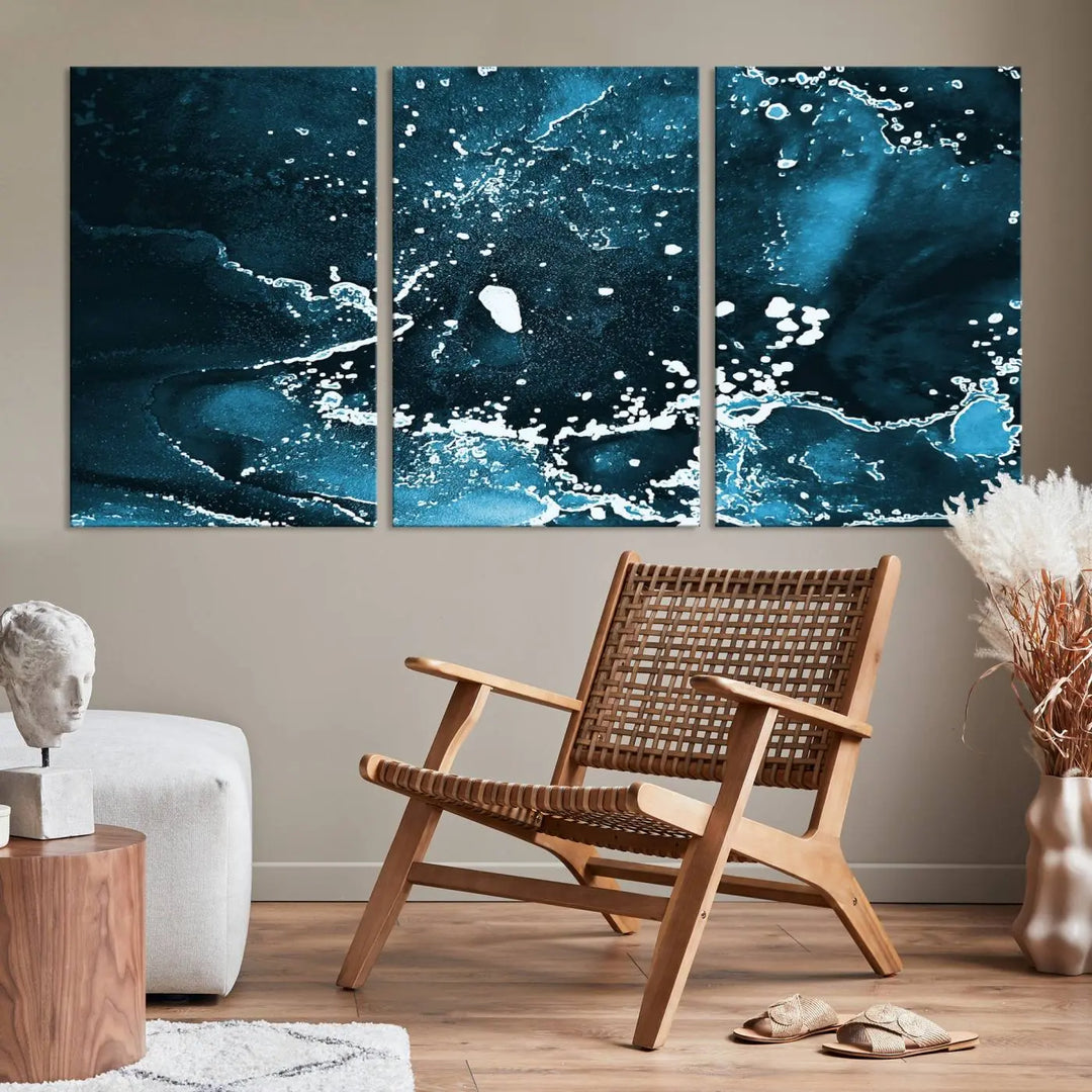 The Blue Marble Ink Splash Effect Wall Art Abstract Canvas Wall Art Print features a gallery-wrapped finish on museum-quality canvas with UV-protective coating, hanging elegantly in the room.