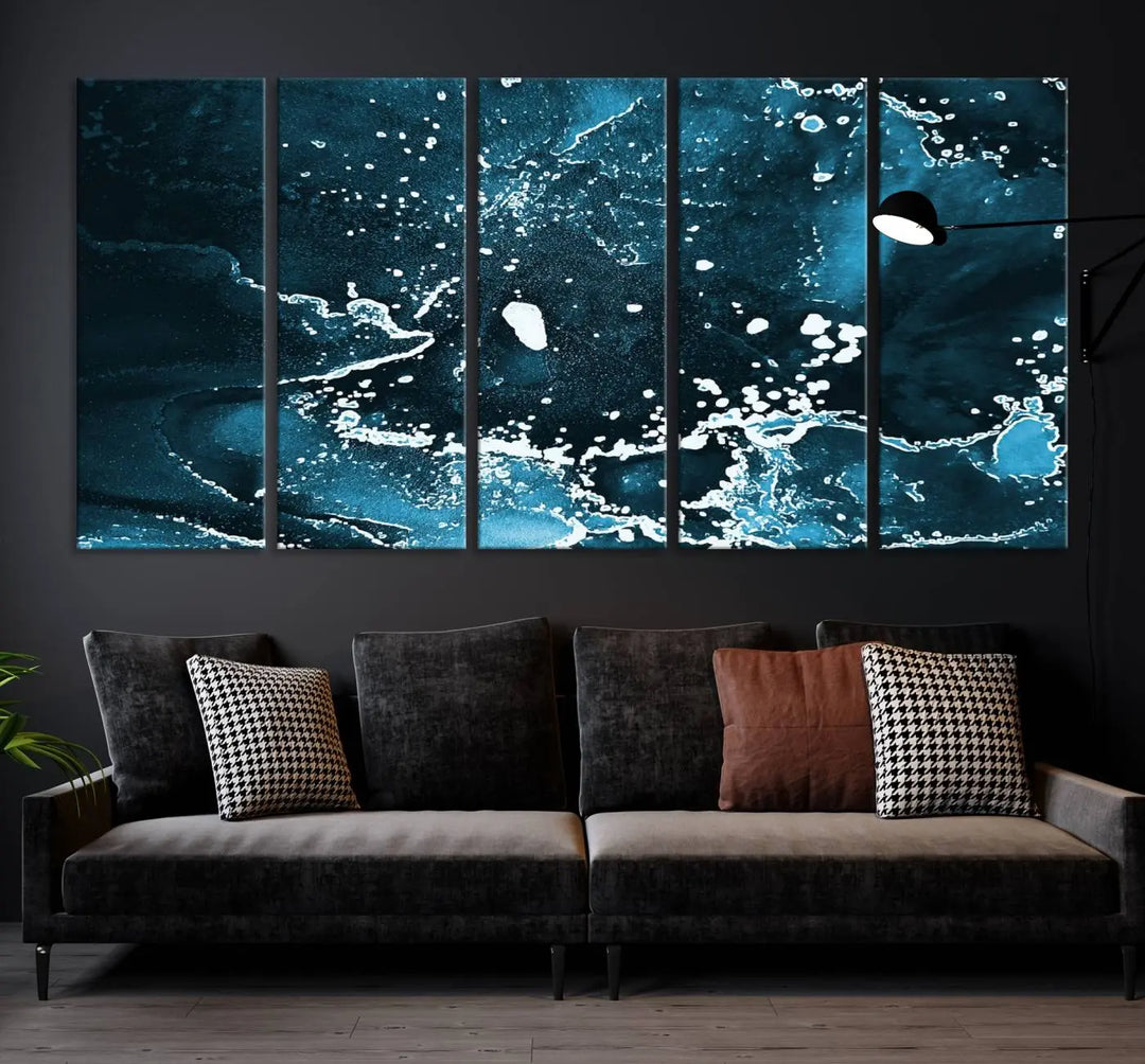 The Blue Marble Ink Splash Effect Wall Art Abstract Canvas Wall Art Print features a gallery-wrapped finish on museum-quality canvas with UV-protective coating, hanging elegantly in the room.