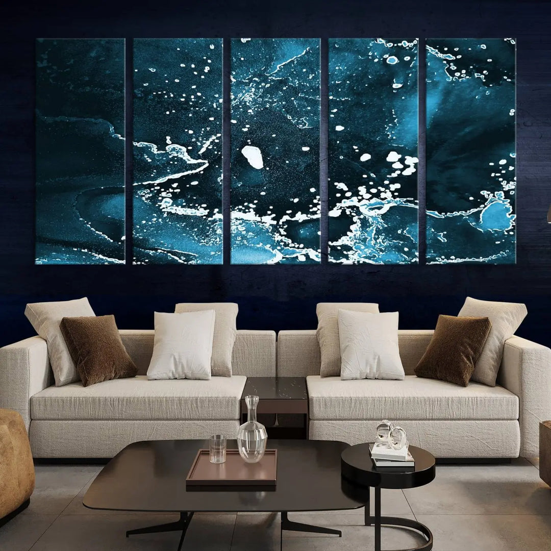 The Blue Marble Ink Splash Effect Wall Art Abstract Canvas Wall Art Print features a gallery-wrapped finish on museum-quality canvas with UV-protective coating, hanging elegantly in the room.